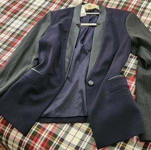 Express Leather trim blazer black leather with blue and gray material.